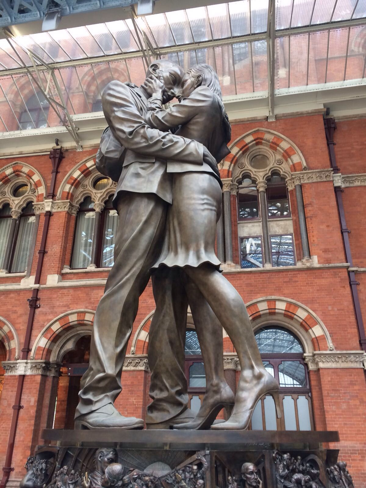 Sir John Betjeman and  an embracing couple  are amongst the icons at  the Meeting Place  St.Pancras Station. Top Tip : you don't have to meet anyone there to enjoy the sculpture